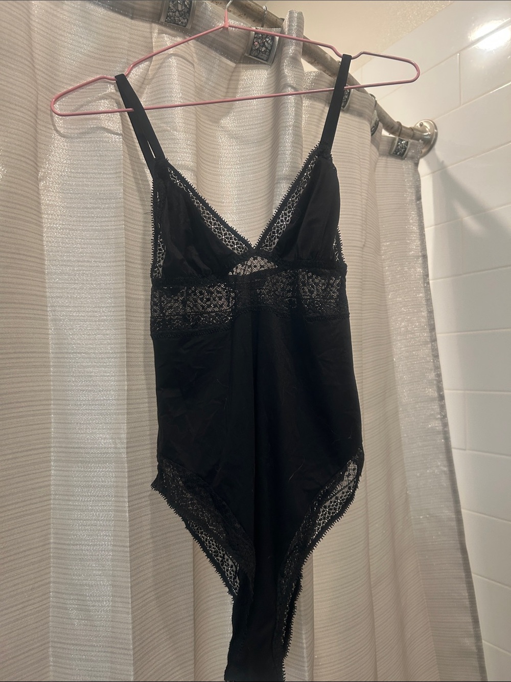 VS women’s black teddy / bodysuit. Worn once. Adjustable straps. Lace accents